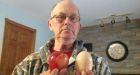 Massive chicken egg cracked open to reveal another egg inside