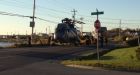 Sea King helicopter towed down street after emergency landing